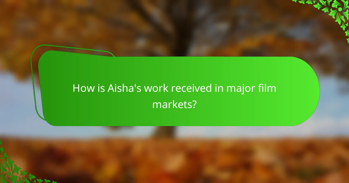 How is Aisha's work received in major film markets?
